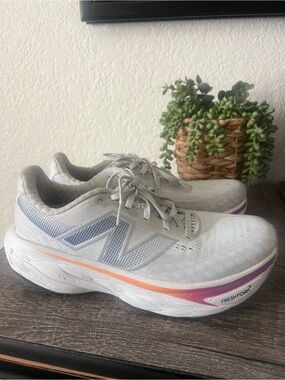 New Balance Women's Gray Athletic Running Shoes with Orange and Purple Accents
